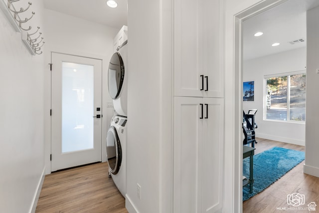 780 W Hillside Dr, Pine Valley, UT 84781 - laundry room with light wood-type flooring and stacked washer and clothes dryer