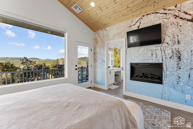 780 W Hillside Dr, Pine Valley, UT 84781 - unfurnished bedroom featuring vaulted ceiling, access to exterior, hardwood / wood-style flooring, wooden ceiling, and a high end fireplace