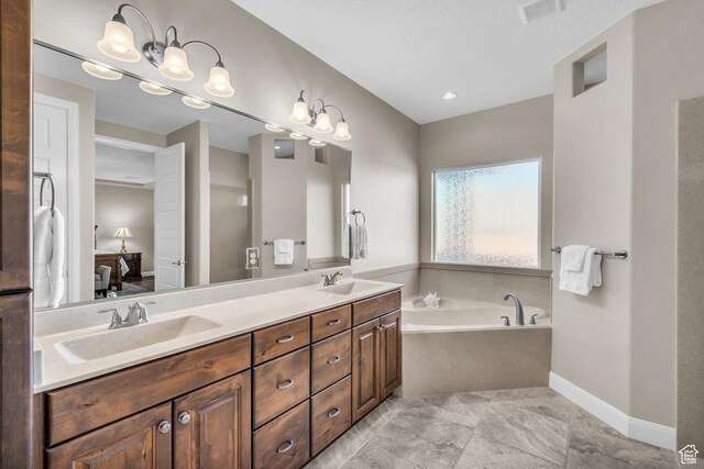 3277 E 3180 S, St George, UT 84790 - bathroom featuring a bath, double vanity, and baseboards