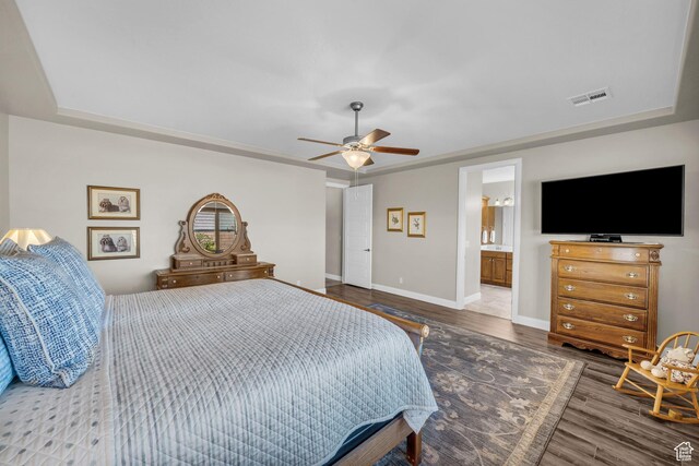 3277 E 3180 S, St George, UT 84790 - bedroom with wood finished floors, baseboards, a ceiling fan, a raised ceiling, and ensuite bath