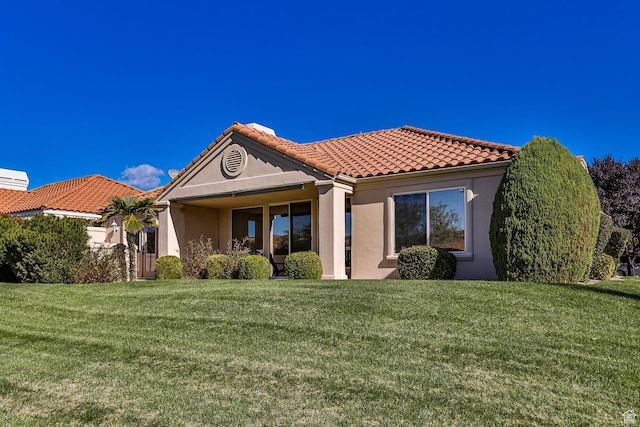 356 N Cactus Ln Unit 9, Washington, UT 84780 - view of front facade featuring stucco siding, a front yard, and a tile roof