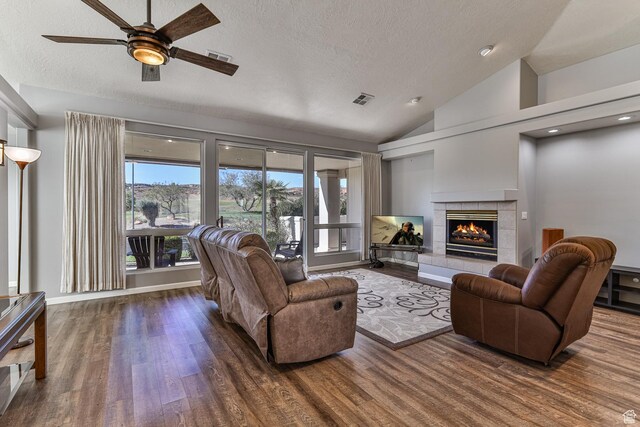 356 N Cactus Ln Unit 9, Washington, UT 84780 - living area featuring a textured ceiling, wood finished floors, a fireplace, ceiling fan, and vaulted ceiling