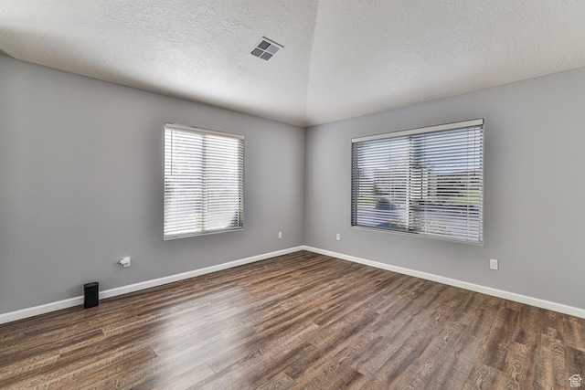 356 N Cactus Ln Unit 9, Washington, UT 84780 - unfurnished room with dark wood-style flooring, baseboards, and a textured ceiling
