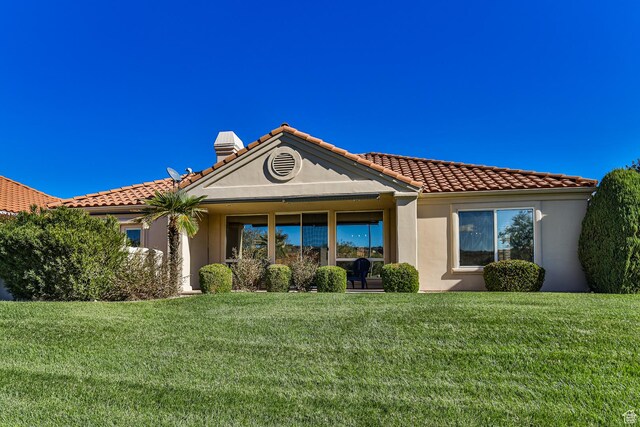 356 N Cactus Ln Unit 9, Washington, UT 84780 - back of property featuring a yard, a tile roof, and stucco siding