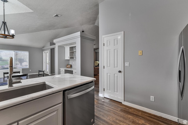 356 N Cactus Ln Unit 9, Washington, UT 84780 - kitchen with stainless steel appliances, vaulted ceiling, a sink, dark wood-type flooring, and light stone counters