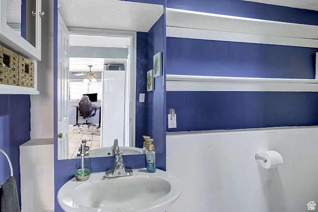 4958 S 3900 W, Roy, UT 84067 - bathroom featuring a sink, a textured ceiling, and a ceiling fan