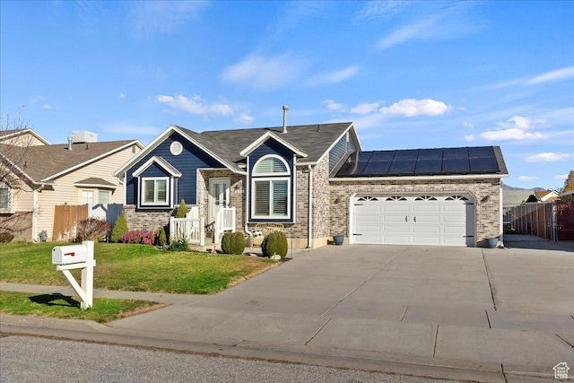 4958 S 3900 W, Roy, UT 84067 - view of front of property with concrete driveway, solar panels, an attached garage, and brick siding