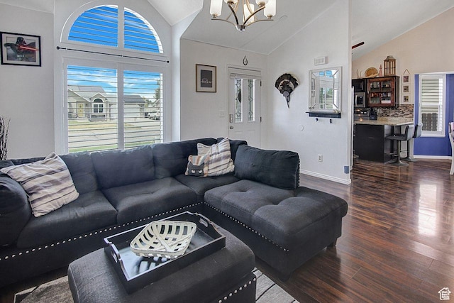 4958 S 3900 W, Roy, UT 84067 - living area featuring lofted ceiling, a chandelier, wood finished floors, and baseboards