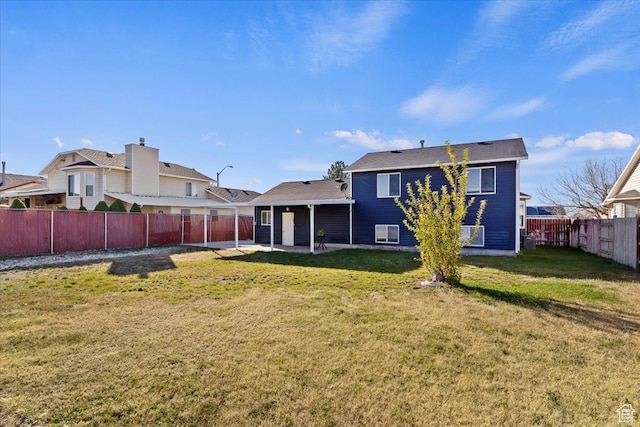 back of property with central AC unit, a patio, and a lawn