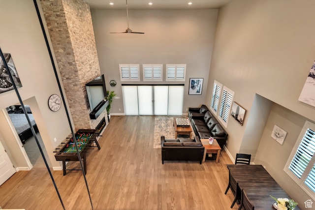10005 N Meer Cir, Heber City, UT 84032 - living room featuring a high ceiling, light wood-type flooring, and a wealth of natural light