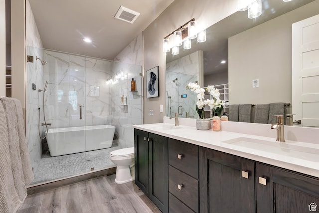 10005 N Meer Cir, Heber City, UT 84032 - full bathroom featuring wood-type flooring, vanity, shower with separate bathtub, and toilet