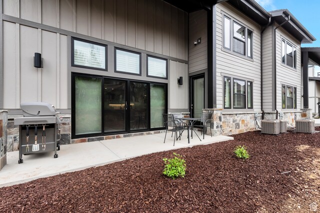 10005 N Meer Cir, Heber City, UT 84032 - back of property with a patio, cooling unit, and area for grilling