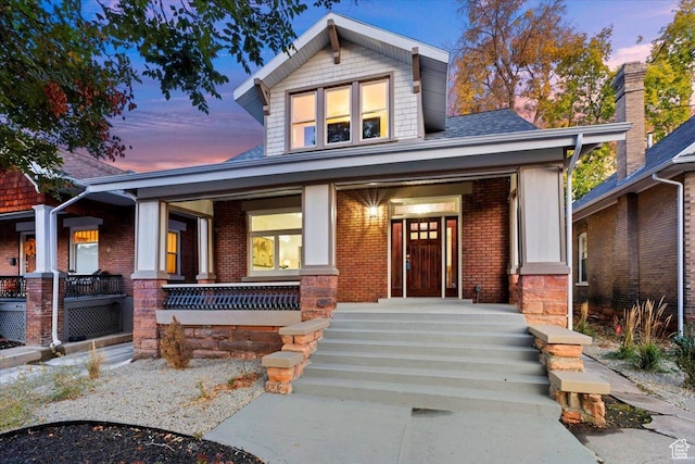 855 S 700 E, Salt Lake City, UT 84102 - view of front of property featuring covered porch and brick siding