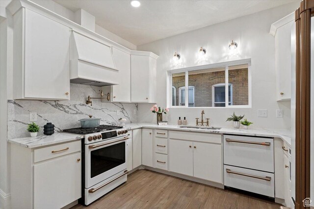855 S 700 E, Salt Lake City, UT 84102 - kitchen with white appliances, a sink, white cabinets, tasteful backsplash, and light wood finished floors