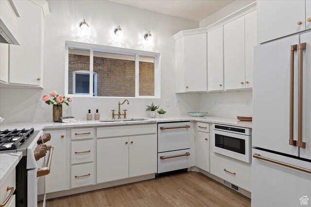 855 S 700 E, Salt Lake City, UT 84102 - kitchen featuring white appliances, a sink, premium range hood, and light countertops