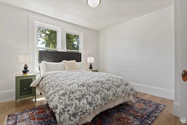 855 S 700 E, Salt Lake City, UT 84102 - bedroom featuring baseboards and wood finished floors