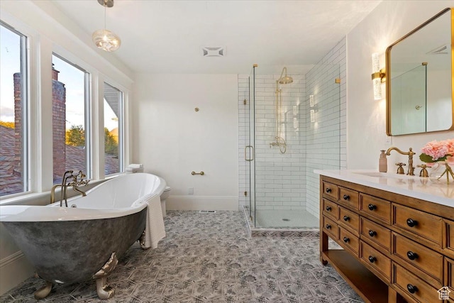 855 S 700 E, Salt Lake City, UT 84102 - bathroom with a shower stall, vanity, a freestanding tub, and baseboards