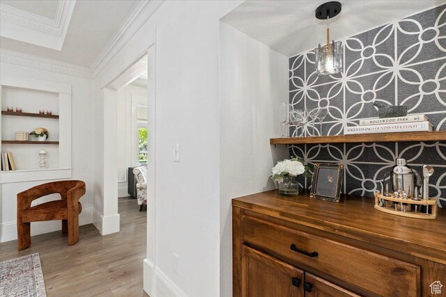 855 S 700 E, Salt Lake City, UT 84102 - bar featuring ornamental molding, wood finished floors, baseboards, and built in shelves