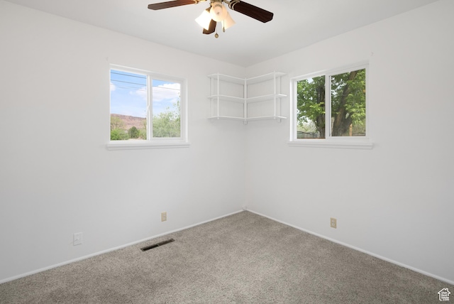 321 Park Rd, Moab, UT 84532 - spare room featuring a ceiling fan and carpet floors