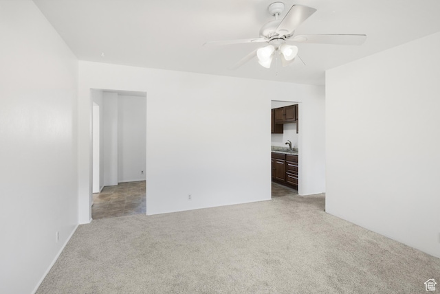 321 Park Rd, Moab, UT 84532 - unfurnished room featuring light colored carpet and a ceiling fan