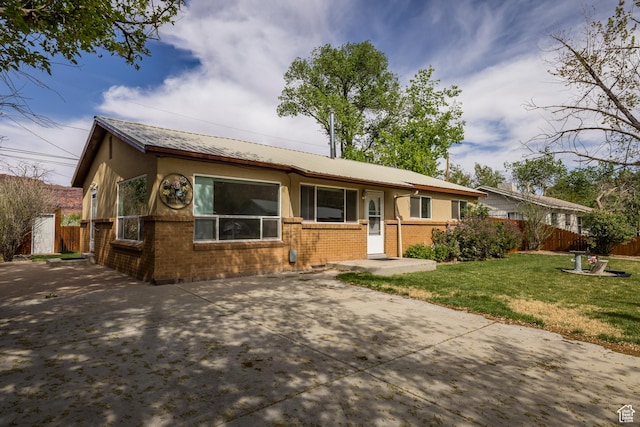 321 Park Rd, Moab, UT 84532 - ranch-style house with brick siding and stucco siding