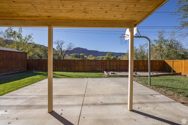 321 Park Rd, Moab, UT 84532 - fenced backyard with a mountain view and a patio