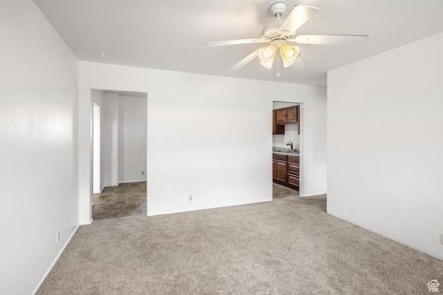 321 Park Rd, Moab, UT 84532 - spare room featuring a ceiling fan and carpet flooring