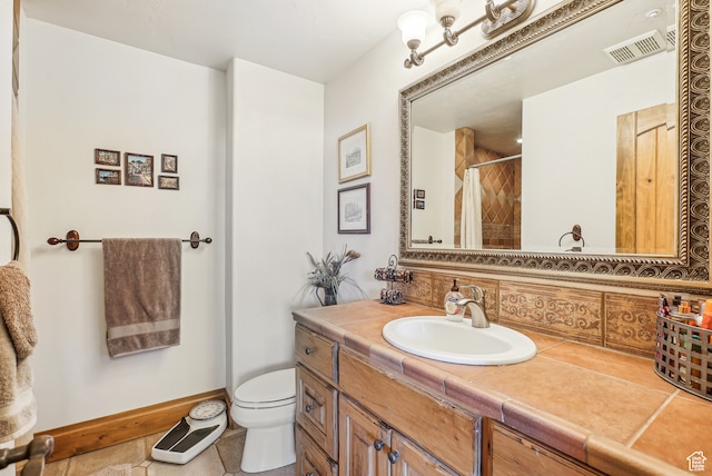bathroom with tile patterned flooring, vanity, toilet, and a shower with shower curtain