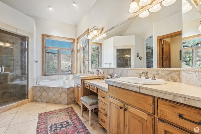 bathroom featuring tile patterned floors, vanity, and plus walk in shower