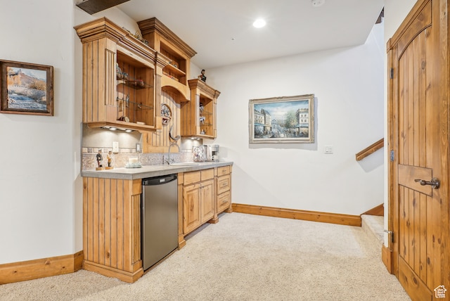 kitchen with sink, light carpet, and stainless steel refrigerator
