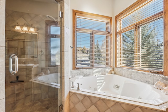 bathroom featuring shower with separate bathtub