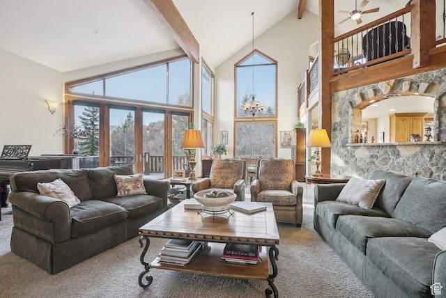 carpeted living room featuring beamed ceiling, french doors, high vaulted ceiling, and ceiling fan