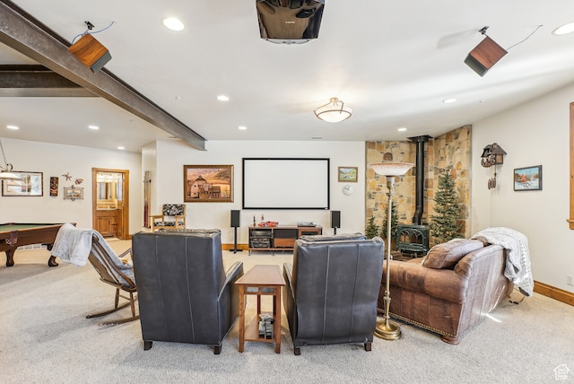 carpeted home theater room featuring beamed ceiling, a wood stove, and billiards