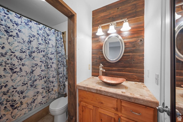 1567 S 1700 E, Spanish Fork, UT 84660 - bathroom featuring walk in shower, vanity, wooden walls, and toilet