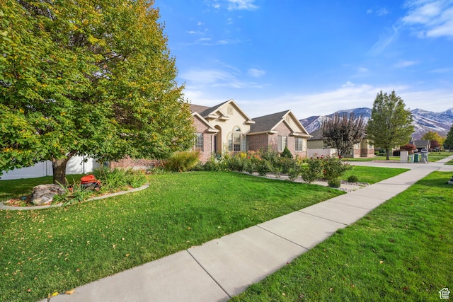 1567 S 1700 E, Spanish Fork, UT 84660 - view of front of property with a front yard and a mountain view