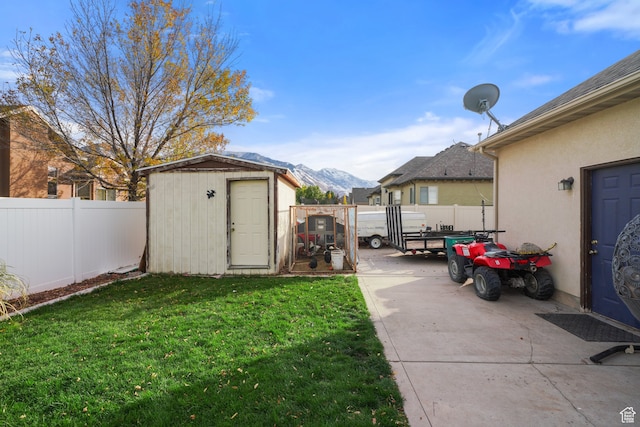 1567 S 1700 E, Spanish Fork, UT 84660 - view of yard with a patio area, a mountain view, and a storage shed