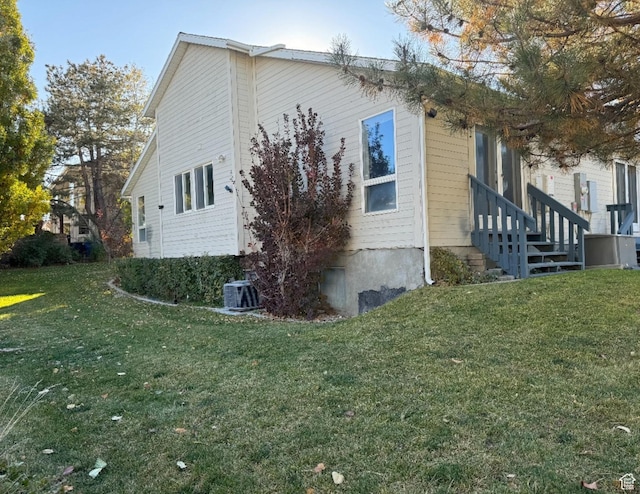 3635 S Arbor Park Dr, Magna, UT 84044 - view of property exterior featuring a yard and central air condition unit