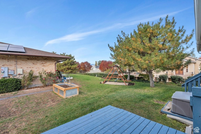 3635 S Arbor Park Dr, Magna, UT 84044 - view of grassy yard featuring a playground and a wooden deck