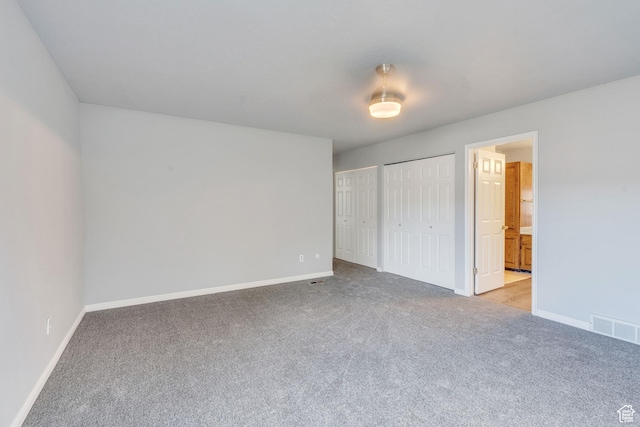 3635 S Arbor Park Dr, Magna, UT 84044 - unfurnished bedroom featuring carpet, multiple closets, baseboards, and ensuite bathroom