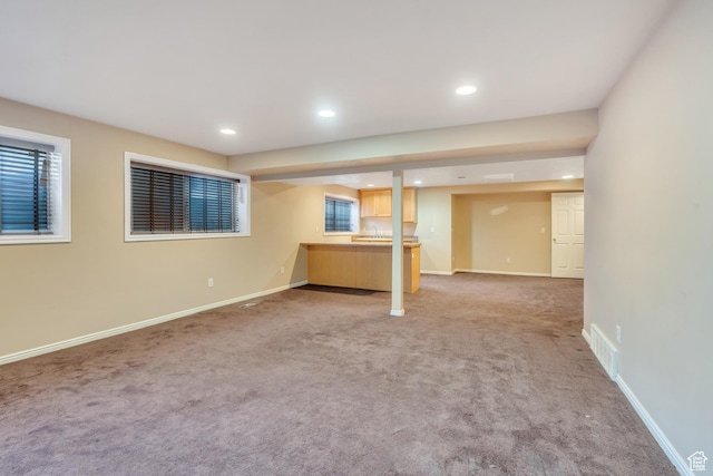 3635 S Arbor Park Dr, Magna, UT 84044 - below grade area with light colored carpet, recessed lighting, baseboards, and a sink