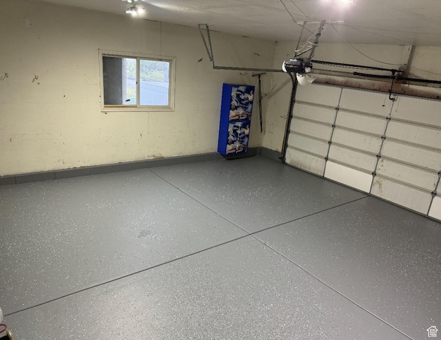 3635 S Arbor Park Dr, Magna, UT 84044 - garage with a garage door opener and baseboards