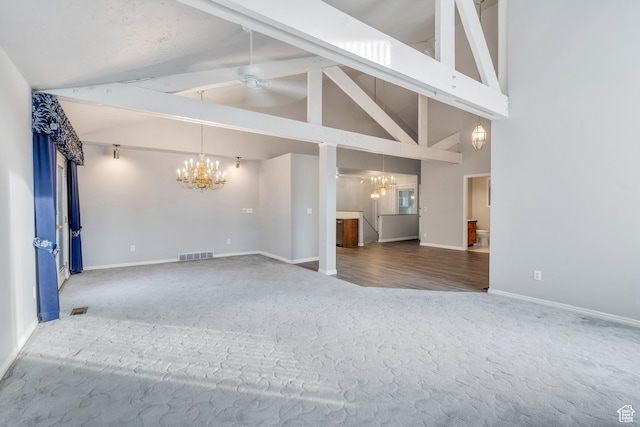 3635 S Arbor Park Dr, Magna, UT 84044 - unfurnished living room with a chandelier, carpet floors, beamed ceiling, baseboards, and ceiling fan
