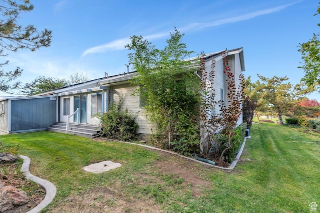 3635 S Arbor Park Dr, Magna, UT 84044 - back of house with a lawn and entry steps