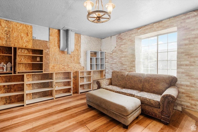 165 S 200 W, Manti, UT 84642 - living room with hardwood / wood-style flooring, a chandelier, and a textured ceiling