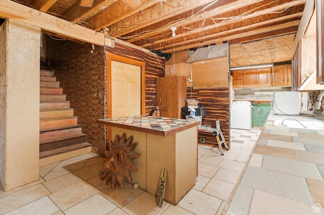 165 S 200 W, Manti, UT 84642 - below grade area with stairs, washing machine and dryer, and light tile patterned floors