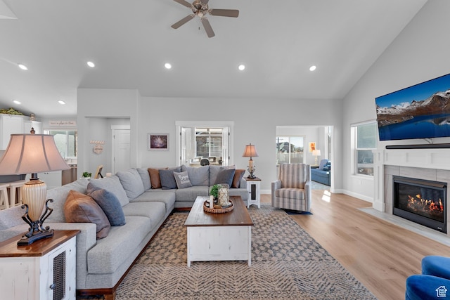 519 N Pintail Ln Unit C, Vineyard, UT 84059 - living area with ceiling fan, light wood finished floors, high vaulted ceiling, a fireplace with flush hearth, and recessed lighting