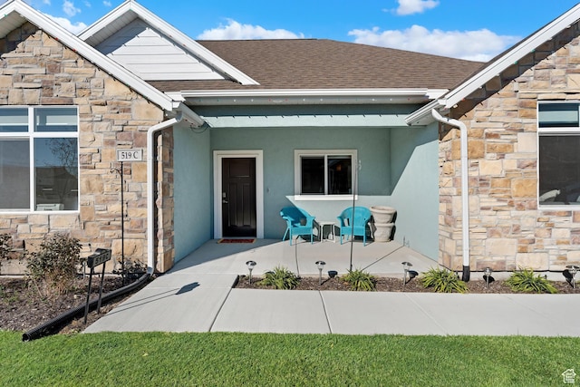519 N Pintail Ln Unit C, Vineyard, UT 84059 - entrance to property with stone siding and roof with shingles