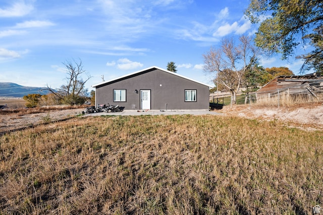 back of property with a mountain view