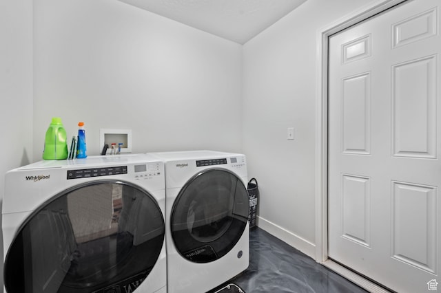 clothes washing area with independent washer and dryer