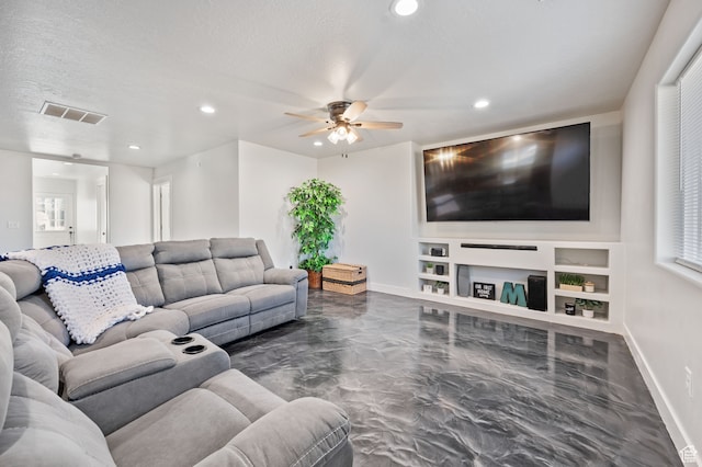 living room with built in features, a textured ceiling, and ceiling fan